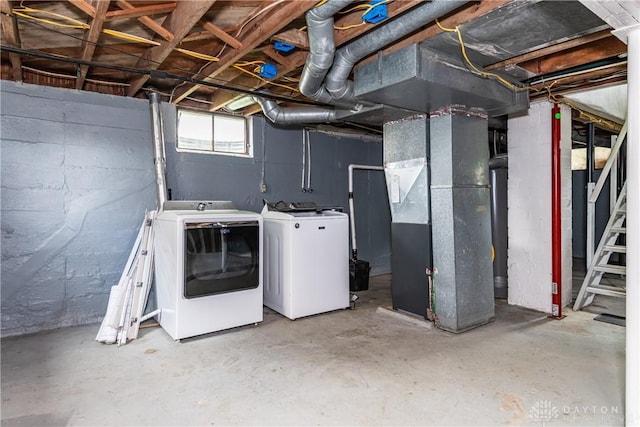 224 Locust Ln, West Milton, OH 45383 - basement featuring separate washer and dryer, heating unit, and stairway