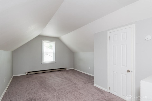 224 Locust Ln, West Milton, OH 45383 - additional living space with a baseboard radiator, carpet floors, vaulted ceiling, and baseboards