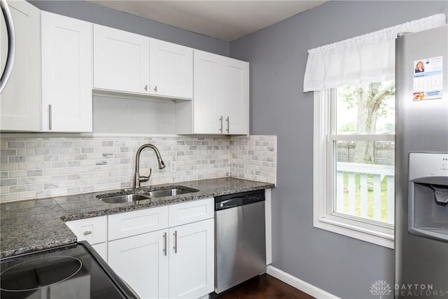 224 Locust Ln, West Milton, OH 45383 - kitchen featuring appliances with stainless steel finishes, a sink, healthy amount of natural light, and white cabinets