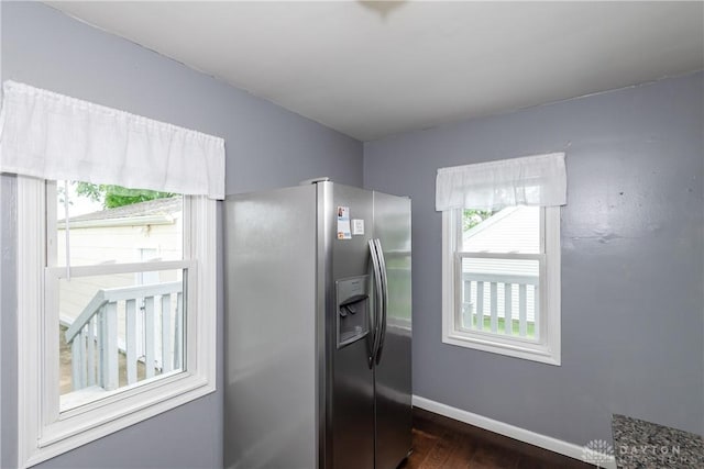 224 Locust Ln, West Milton, OH 45383 - kitchen featuring stainless steel fridge, healthy amount of natural light, dark wood-type flooring, and baseboards