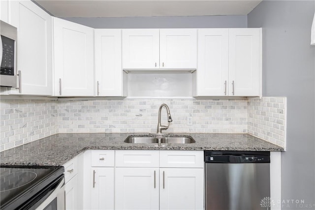 224 Locust Ln, West Milton, OH 45383 - kitchen featuring stainless steel appliances, a sink, and white cabinetry