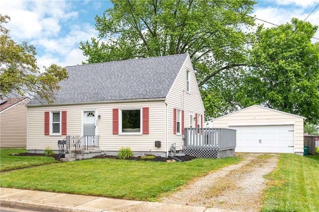 224 Locust Ln, West Milton, OH 45383 - cape cod house featuring a garage, roof with shingles, an outdoor structure, and a front lawn