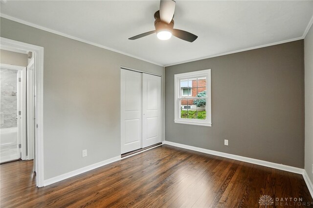 1725 Humphrey Ave, Dayton, OH 45410 - unfurnished bedroom featuring dark wood finished floors, ornamental molding, a closet, and ceiling fan