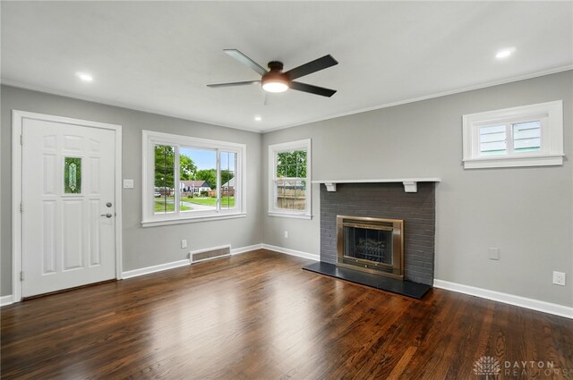 1725 Humphrey Ave, Dayton, OH 45410 - unfurnished living room with a ceiling fan, wood finished floors, a brick fireplace, ornamental molding, and recessed lighting
