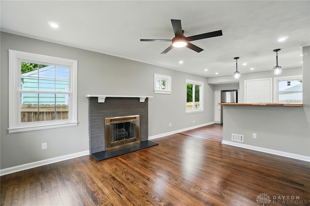 1725 Humphrey Ave, Dayton, OH 45410 - unfurnished living room with ceiling fan, dark wood-style floors, a glass covered fireplace, recessed lighting, and crown molding