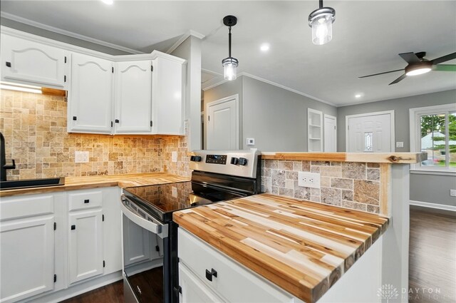 1725 Humphrey Ave, Dayton, OH 45410 - kitchen with butcher block countertops, stainless steel range with electric stovetop, ornamental molding, dark wood-style floors, and backsplash