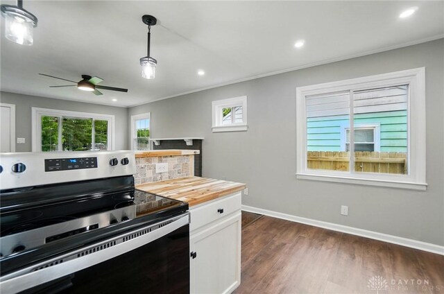 1725 Humphrey Ave, Dayton, OH 45410 - kitchen with electric stove, wood counters, ornamental molding, dark wood-type flooring, and recessed lighting
