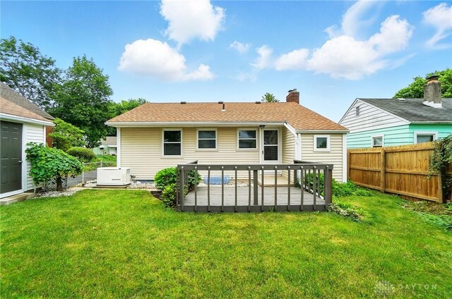 1725 Humphrey Ave, Dayton, OH 45410 - rear view of property featuring a fenced backyard, a chimney, and a patio area