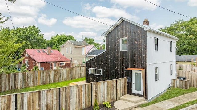 165 Mcreynolds St, Dayton, OH 45403 - rear view of house with a chimney