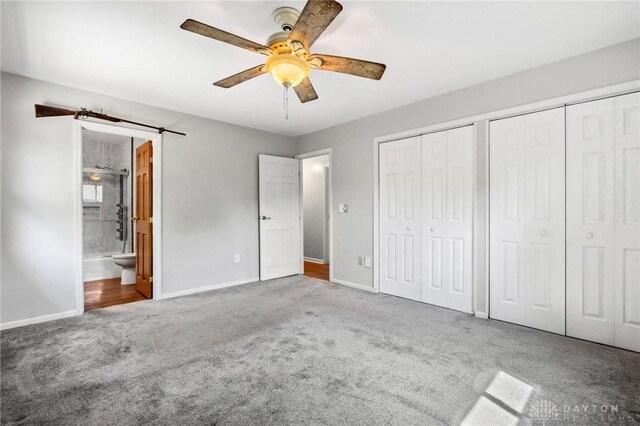 4278 Crownwood Ave, Dayton, OH 45415 - unfurnished bedroom featuring carpet flooring, two closets, ensuite bathroom, and a ceiling fan