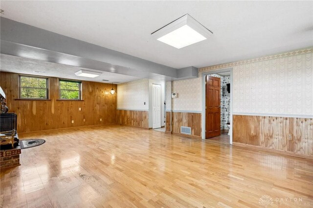 4278 Crownwood Ave, Dayton, OH 45415 - unfurnished room with wood finished floors, wood walls, and wainscoting