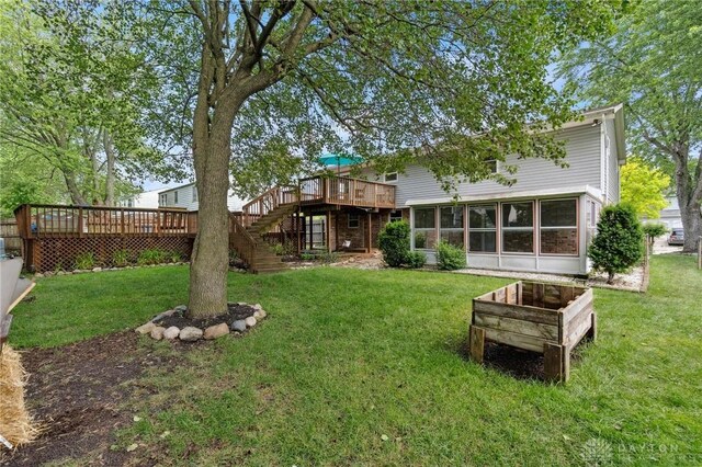 4278 Crownwood Ave, Dayton, OH 45415 - rear view of house with a wooden deck, stairway, and a lawn
