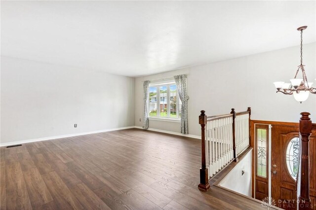 4278 Crownwood Ave, Dayton, OH 45415 - empty room with a chandelier and dark wood-type flooring