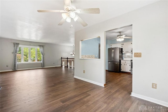 4278 Crownwood Ave, Dayton, OH 45415 - unfurnished living room with ceiling fan, dark wood finished floors, and a chandelier
