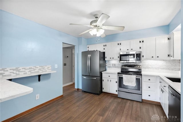 4278 Crownwood Ave, Dayton, OH 45415 - kitchen with stainless steel appliances, backsplash, ceiling fan, and white cabinets
