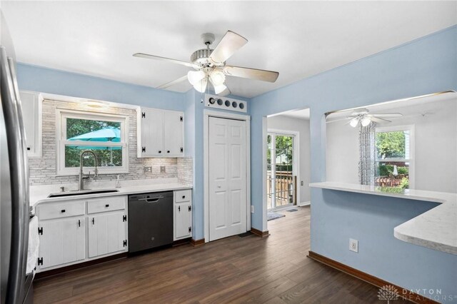 4278 Crownwood Ave, Dayton, OH 45415 - kitchen with dishwasher, ceiling fan, light countertops, decorative backsplash, and white cabinetry