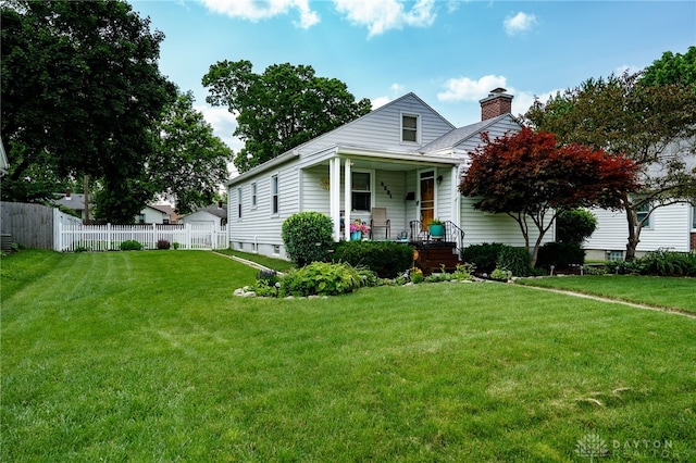 2231 King Ave, Dayton, OH 45420 - view of front of house featuring a chimney and covered porch
