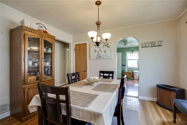 2231 King Ave, Dayton, OH 45420 - dining room featuring light wood-style floors, crown molding, and a ceiling fan