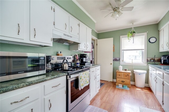 2231 King Ave, Dayton, OH 45420 - kitchen featuring appliances with stainless steel finishes, under cabinet range hood, light wood finished floors, white cabinetry, and crown molding