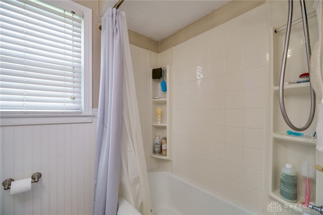 2231 King Ave, Dayton, OH 45420 - full bathroom featuring shower / bath combination with curtain, a textured ceiling, and a wainscoted wall