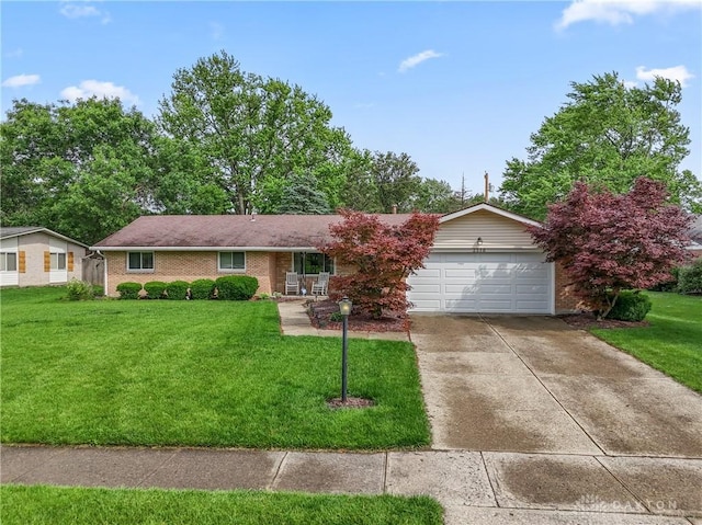 2378 E Rahn Rd, Kettering, OH 45440 - single story home featuring an attached garage, concrete driveway, a front lawn, brick siding, and a porch