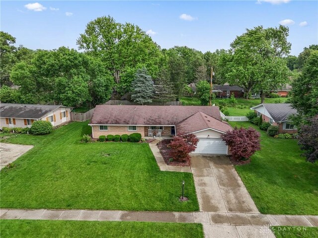 2378 E Rahn Rd, Kettering, OH 45440 - ranch-style house with driveway, a front lawn, and an attached garage
