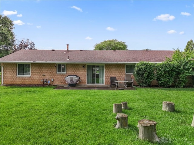 2378 E Rahn Rd, Kettering, OH 45440 - back of house featuring a yard and brick siding