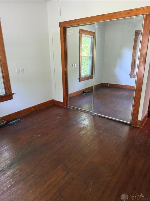 114 N Clayton Rd, New Lebanon, OH 45345 - unfurnished bedroom featuring hardwood / wood-style flooring and a closet