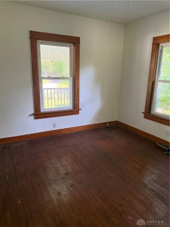 114 N Clayton Rd, New Lebanon, OH 45345 - spare room with dark wood-style flooring and baseboards
