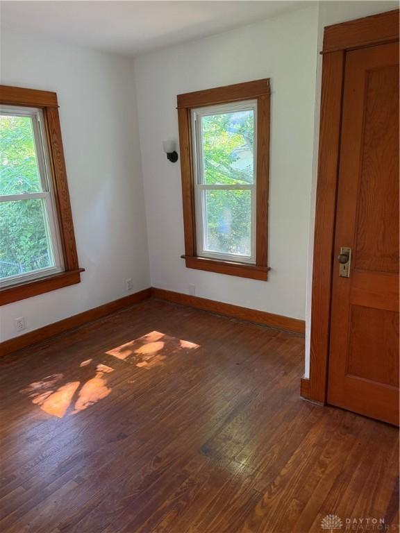 114 N Clayton Rd, New Lebanon, OH 45345 - spare room featuring plenty of natural light and wood finished floors