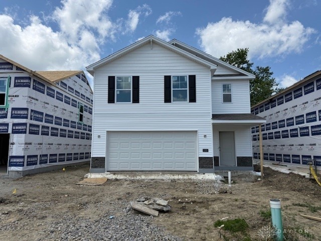 1005 N S St, Wilmington, OH 45177 - view of front of home with an attached garage and driveway
