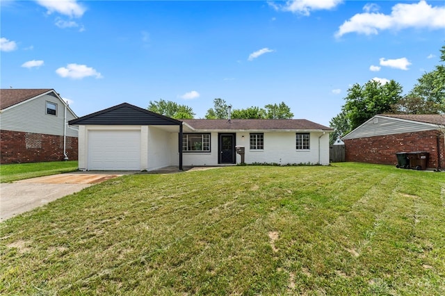 1927 Vermont Dr, Xenia, OH 45385 - ranch-style house featuring an attached garage, driveway, a front yard, and brick siding