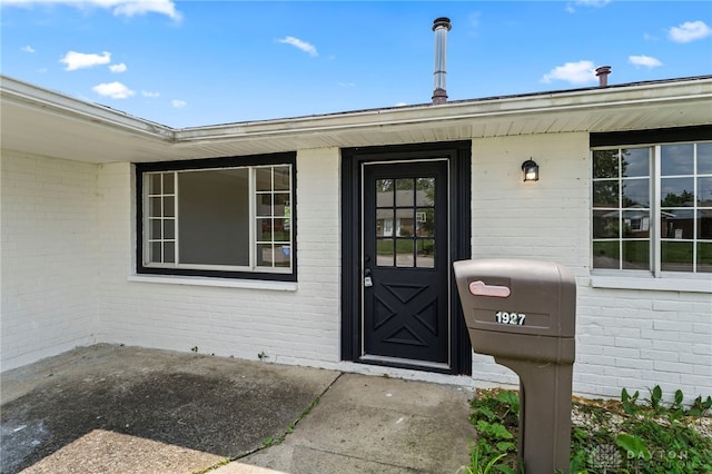 1927 Vermont Dr, Xenia, OH 45385 - property entrance featuring brick siding