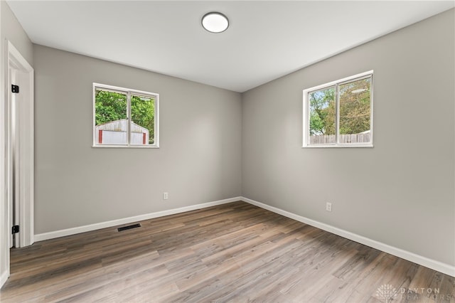 1927 Vermont Dr, Xenia, OH 45385 - empty room with baseboards and wood finished floors
