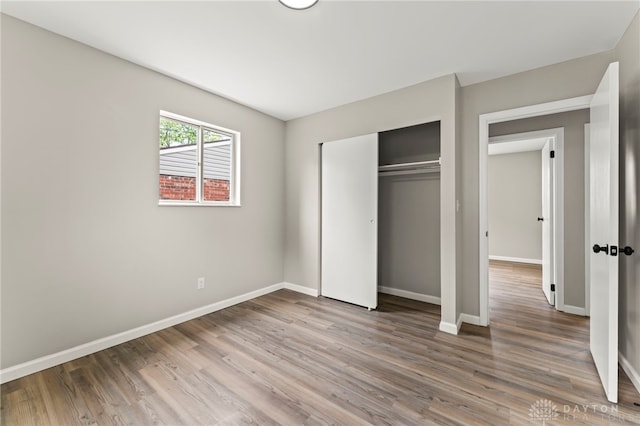 1927 Vermont Dr, Xenia, OH 45385 - unfurnished bedroom with wood finished floors and a closet