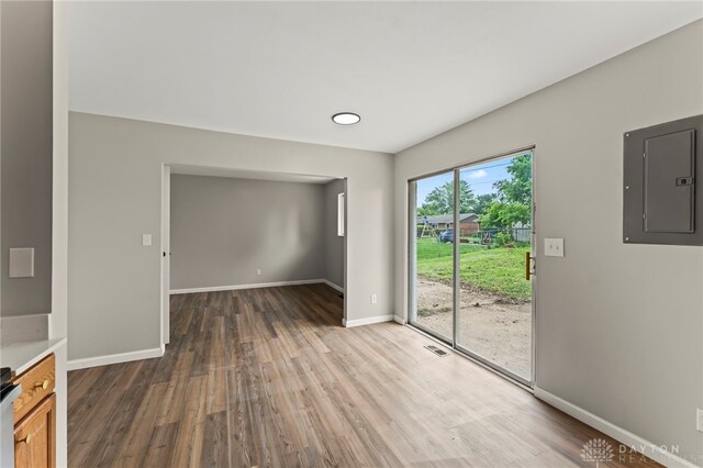 1927 Vermont Dr, Xenia, OH 45385 - unfurnished dining area featuring electric panel and wood finished floors