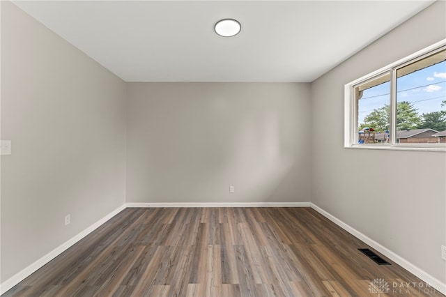 1927 Vermont Dr, Xenia, OH 45385 - spare room featuring wood finished floors and baseboards