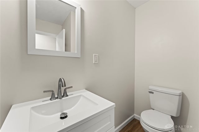 1927 Vermont Dr, Xenia, OH 45385 - half bath featuring wood finished floors and vanity
