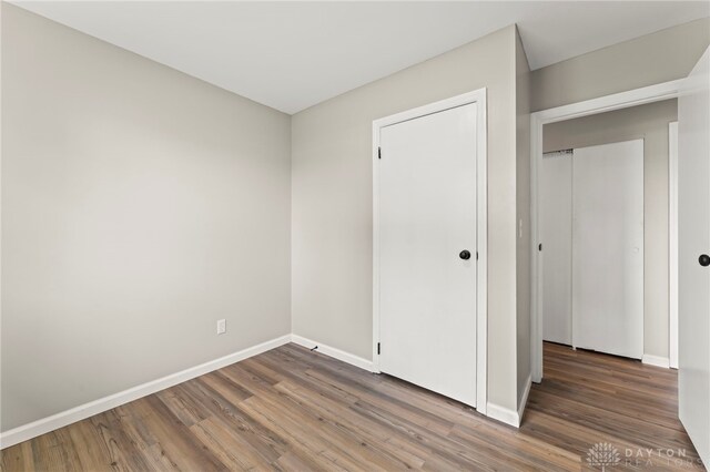 1927 Vermont Dr, Xenia, OH 45385 - unfurnished bedroom featuring wood finished floors