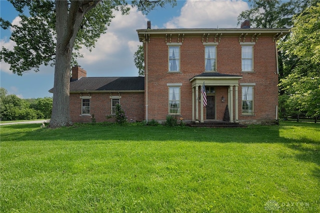 3149 W State Route 73, Wilmington, OH 45177 - italianate-style house with a chimney, a front lawn, and brick siding
