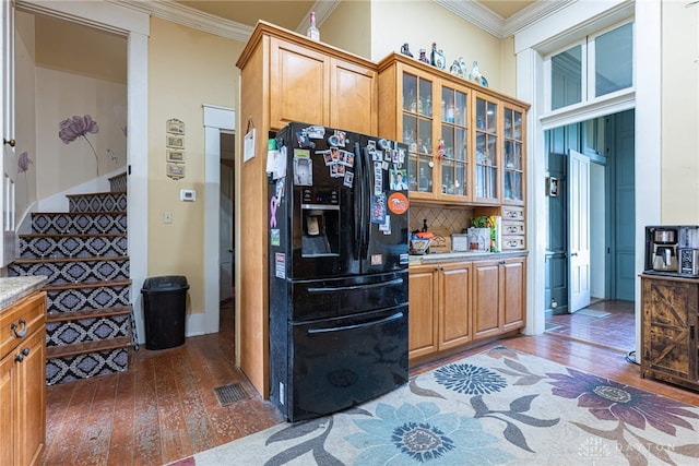 3149 W State Route 73, Wilmington, OH 45177 - kitchen with black refrigerator with ice dispenser, wood-type flooring, ornamental molding, light countertops, and decorative backsplash
