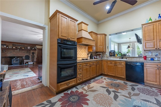3149 W State Route 73, Wilmington, OH 45177 - kitchen with black appliances, a ceiling fan, crown molding, decorative backsplash, and brown cabinetry
