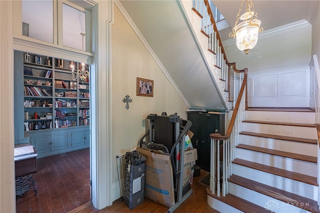 3149 W State Route 73, Wilmington, OH 45177 - staircase featuring hardwood / wood-style floors, crown molding, a chandelier, and built in features