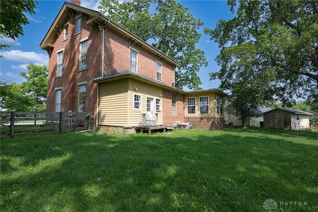 3149 W State Route 73, Wilmington, OH 45177 - back of property with a shed, brick siding, and a chimney