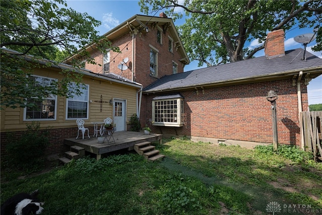 3149 W State Route 73, Wilmington, OH 45177 - back of property with a chimney, a deck, and brick siding