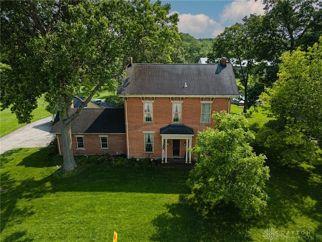 3149 W State Route 73, Wilmington, OH 45177 - back of property featuring a yard, brick siding, a chimney, and driveway