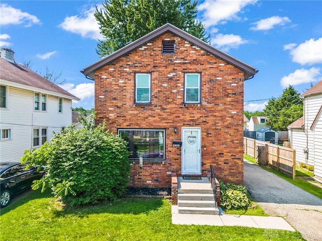1707 Maiden Ln, Springfield, OH 45504 - view of property featuring brick siding and asphalt driveway