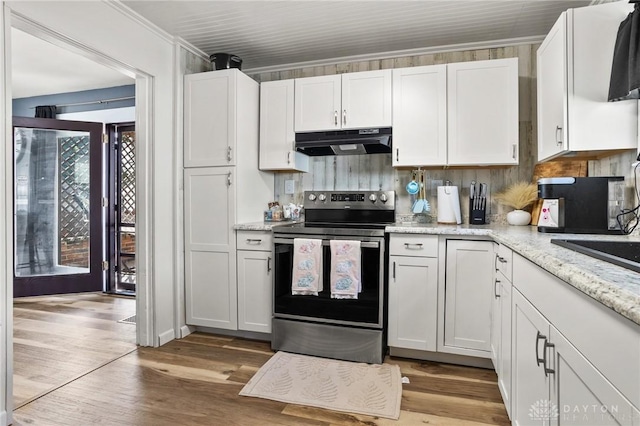 1707 Maiden Ln, Springfield, OH 45504 - kitchen featuring stainless steel range with electric cooktop, under cabinet range hood, white cabinetry, and ornamental molding
