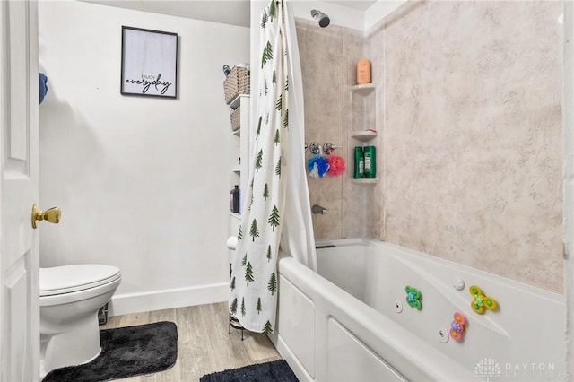 1707 Maiden Ln, Springfield, OH 45504 - bathroom featuring wood finished floors and shower / tub combo with curtain