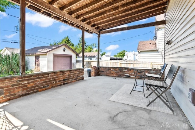 1707 Maiden Ln, Springfield, OH 45504 - view of patio with an outbuilding and a detached garage